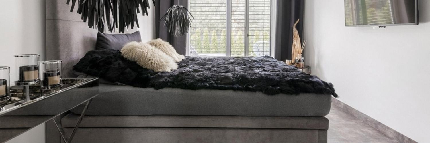 Bedroom in a private house with a window overlooking the yard, a common entry point for intruders
